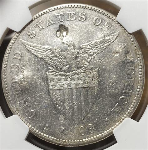 My chopmarked 1903 S Philippine Peso. Started life in San Francisco ...