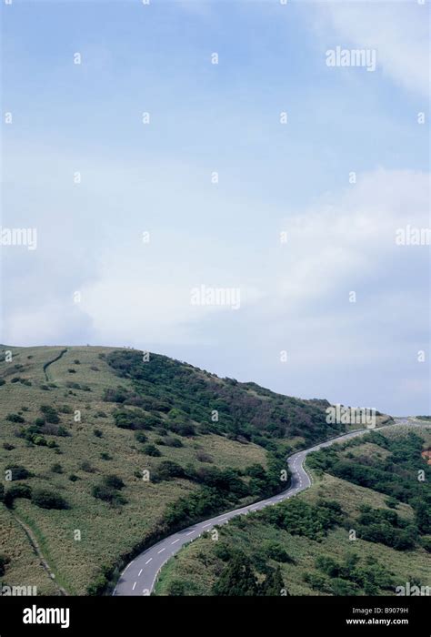 Winding road through mountain Stock Photo - Alamy