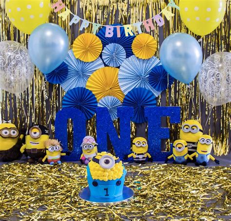 a birthday party with minion decorations and balloons