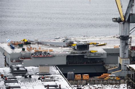 Collapsed dock crane pictured on Russian aircraft carrier after ...