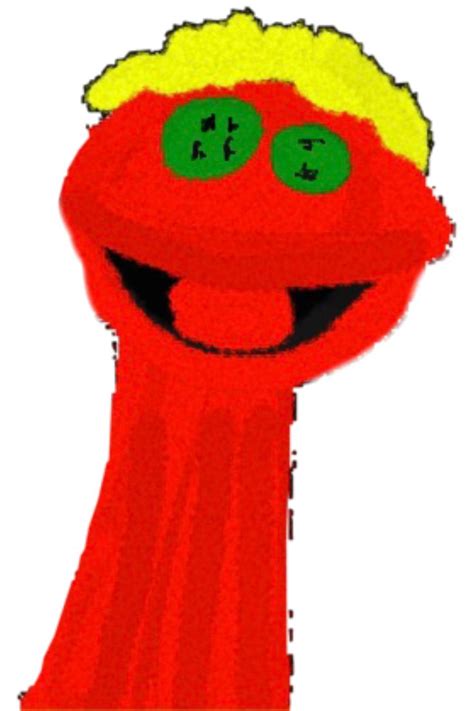 a red object with two green eyes and a smile on it's face is shown