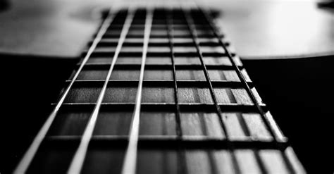 Steel strings of classical guitar in room · Free Stock Photo