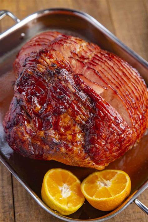 Baked Ham with Brown Sugar Glaze made with brown sugar, orange juice, honey, and spices is the ...