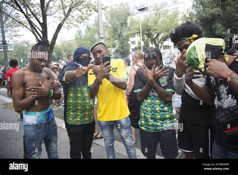 Crew of young men cruzing about at the parade. Spectators along Eastern ...