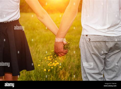 boyfriend and girlfriend holding hands, romantic relationship Stock Photo - Alamy