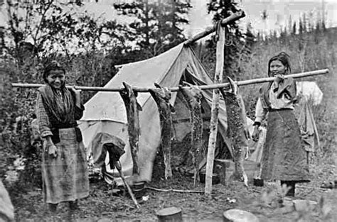 Athabascan girls displaying Salmon near the Pelly River area of Yukon ...