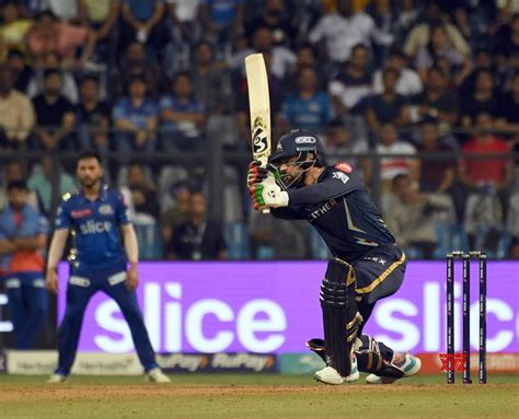 Mumbai : GT's Rashid Khan plays a shot during the IPL 2023 match # ...