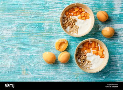 Homemade yogurt with granola, apricot and pine nuts Stock Photo - Alamy