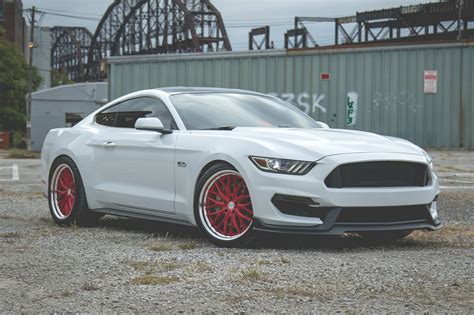 Striking Contrast: Custom Red Vossen Wheels on White Ford Mustang ...