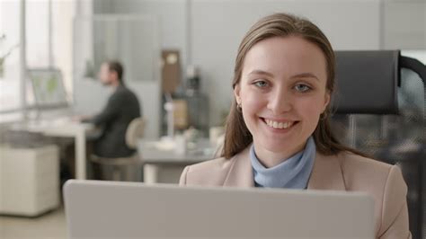 Free stock video - Close up view of woman using laptop sitting at table in the office 1