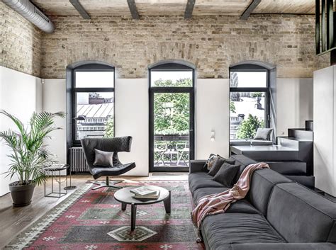 Trendy Loft Apartment with Exposed Brick Walls and Huge Windows - InteriorZine