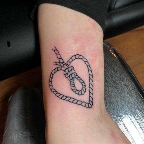 Heart-shaped rope with a hangman’s knot inside tattooed on the arm | Tattoos, Rope tattoo, Neck ...