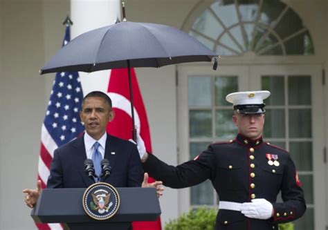 President Obama’s Umbrella Holding Marine [POLL]