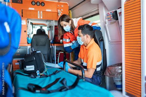 Paramedic Workers Inside an Ambulance Stock Photo | Adobe Stock