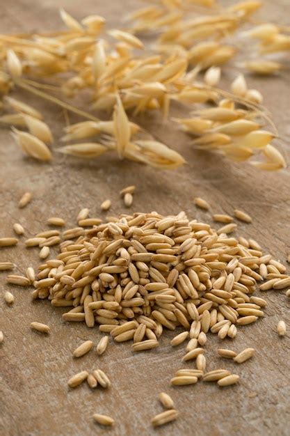 Premium Photo | Heap of organic oat seeds close up