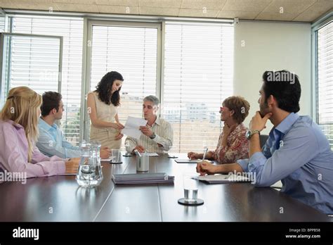 Group of people in boardroom meeting Stock Photo - Alamy