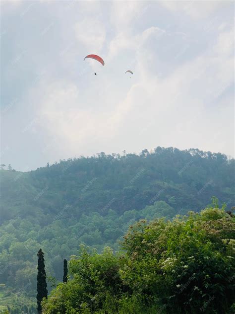 Premium Photo | Paragliding in batu city