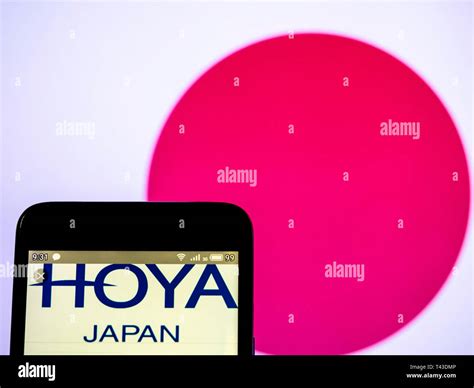 In this photo illustration a Hoya Corporation logo seen displayed on a smart phone Stock Photo ...