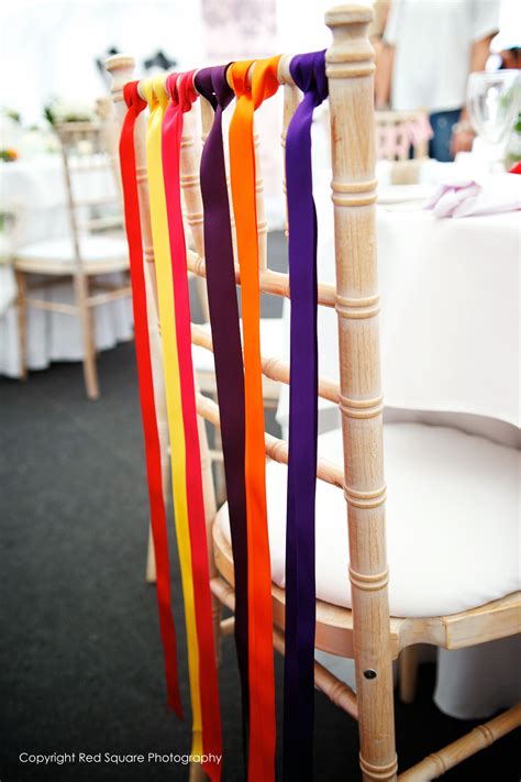 Ribbons on chairs - can be created with brights, pastels or colours to match your theme ...