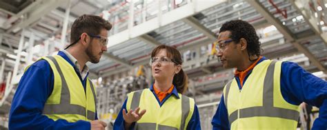 Factory Workers Having a Discussion - Lubrication Engineering