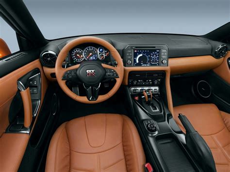 the interior of a sports car with tan leather trims and gauges on display
