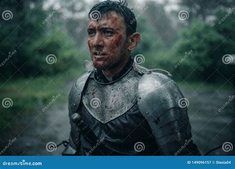 Portrait of Young Man in the Image of a Medieval Knight with Blood and Wounds on His Face Stock ...