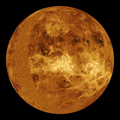 Photo of Venus from Magellan mission, 1996. Dark spots are meteorite ...