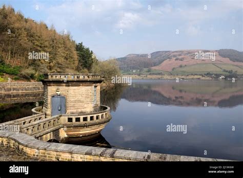 Water outlet tower on the Ladybower Reservoir dam, in the Dark Peak of the Peak District ...