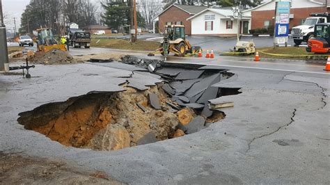 PHOTOS: Road washed out due to water main break in Putnam County | WZTV