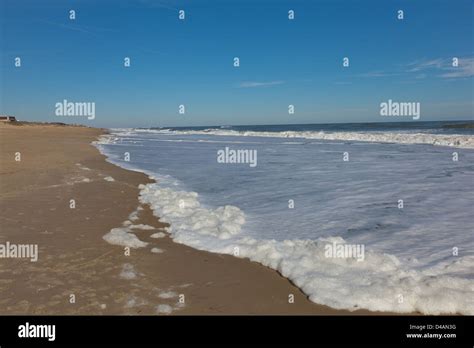 Waves receding from a beach in North Carolina Stock Photo - Alamy