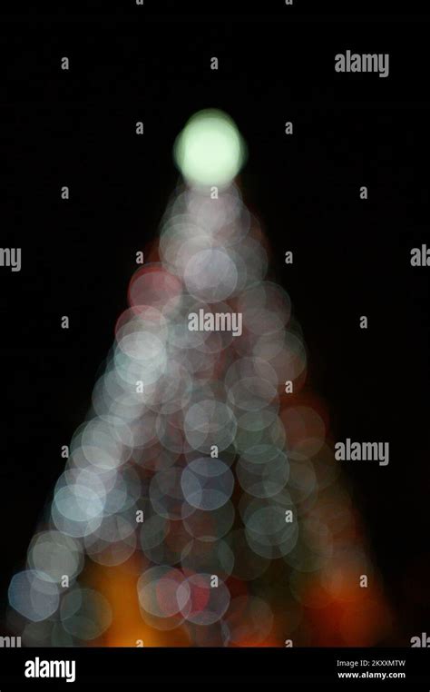 Christmas tree with lights glowing Stock Photo - Alamy