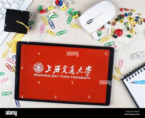 In this photo illustration, Shanghai Jiao Tong University logo seen displayed on a tablet Stock ...