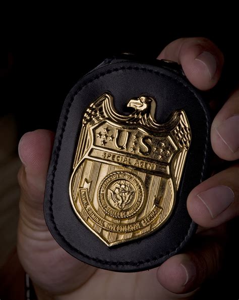 File:NCIS Badge in hand.jpg - Wikimedia Commons