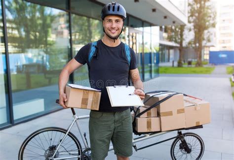 Bike Courier Making a Delivery Stock Photo - Image of biker, carton: 150160400