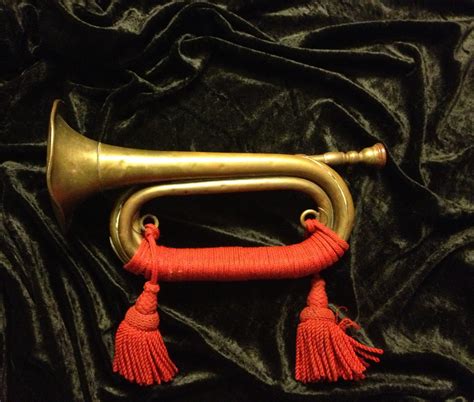 I do have a 200 year old bugle, reddish, coppery, brass finish, no ...