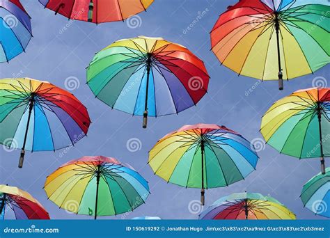 Rainbow colors umbrellas stock photo. Image of season - 150619292