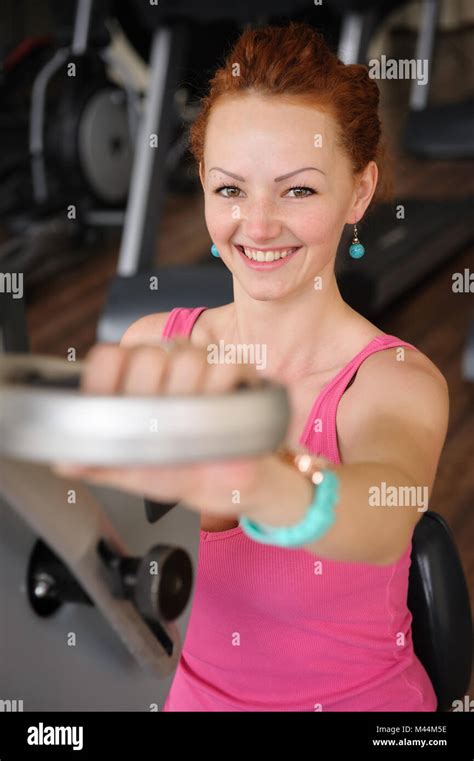 girl doing hands spinning machine workout Stock Photo - Alamy