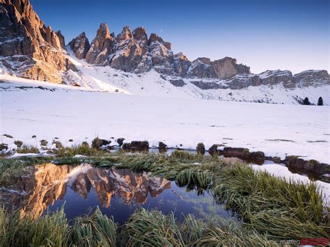 Matteo Colombo Photography | Mountain range reflected in lake at sunset with snow Dolomites ...