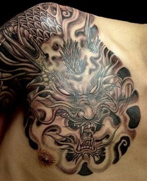 Scary grey-ink eyeless chinese dragon tattoo on chest and shoulder ...