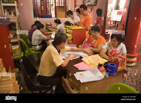 Fortune tellers and customers in Chinese temple Kuala Lumpur Malaysia ...