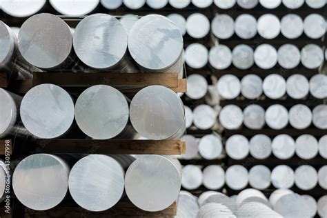 aluminium round bars in outdoor storage Stock Photo | Adobe Stock