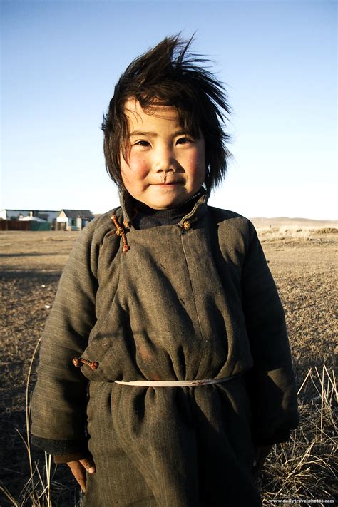 Wild Mongolia - A cute Mongolian girl poses on the plains in central ...