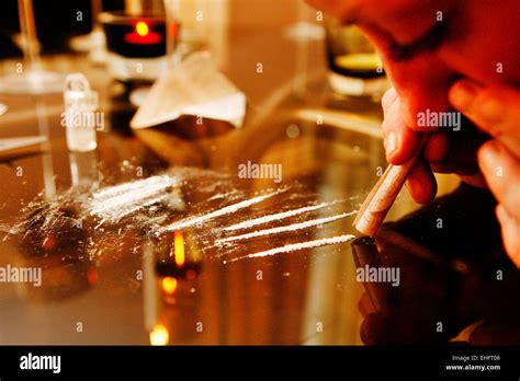 Taking Cocaine at a dinner party London Stock Photo - Alamy