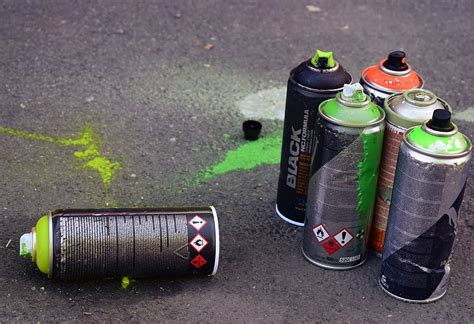 HD wallpaper: Used spray cans sitting on the ground., colors, street ...