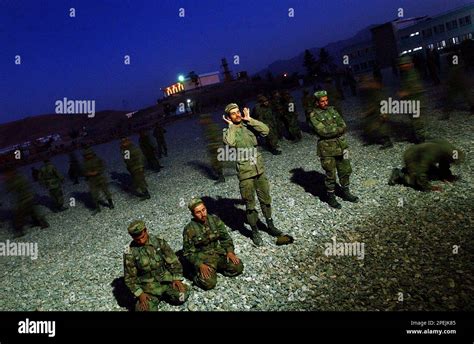 Soldiers from Afghanistan National Army pray before breaking their Ramadan fast at the Military ...