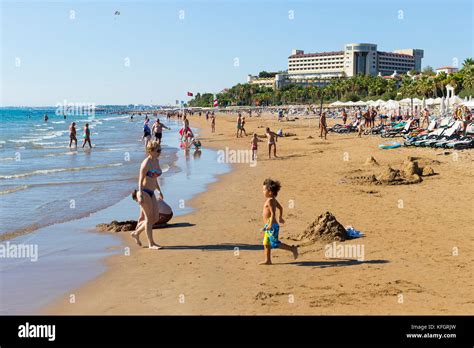 SIDE, TURKEY - 4 OCTOBER, 2017: Coast of Side in Turkey beaches of hotels with resting tourists ...