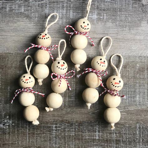 Wood Bead Snowman Ornaments | Beaded snowman, Christmas crafts ...