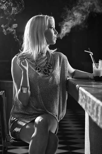 Elegant Woman Smoking Cigarette And Drinking In The Bar Stock Photo - Download Image Now - iStock