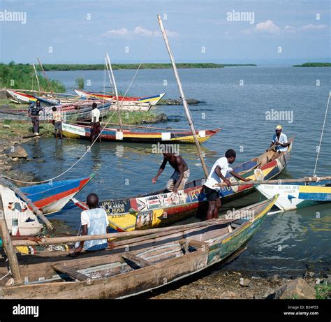 Kenya, Kisumu, Dunga Beach. Brightly painted fishing boats of the Luo ...