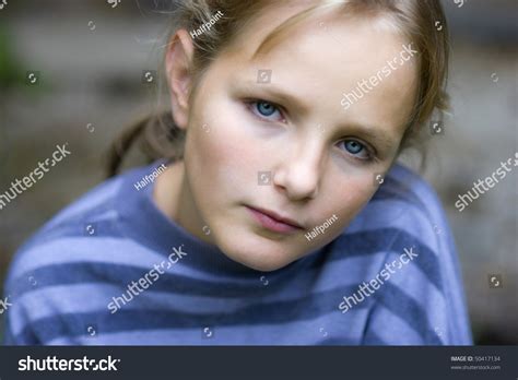 Sad Little Girl Is Looking With Serious Face At Camera. Stock Photo 50417134 : Shutterstock